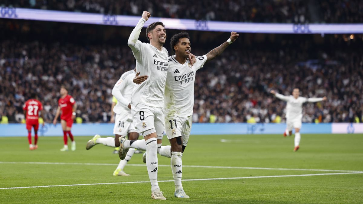 Real Madrid players celebrate a goal