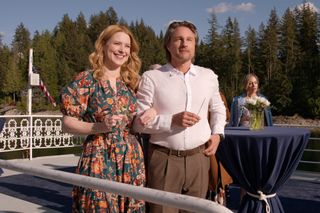 Alexandra Breckenridge as Mel Monroe and Martin Henderson as Jack Sheridan at a wedding celebration party on a roof in virgin river season 6