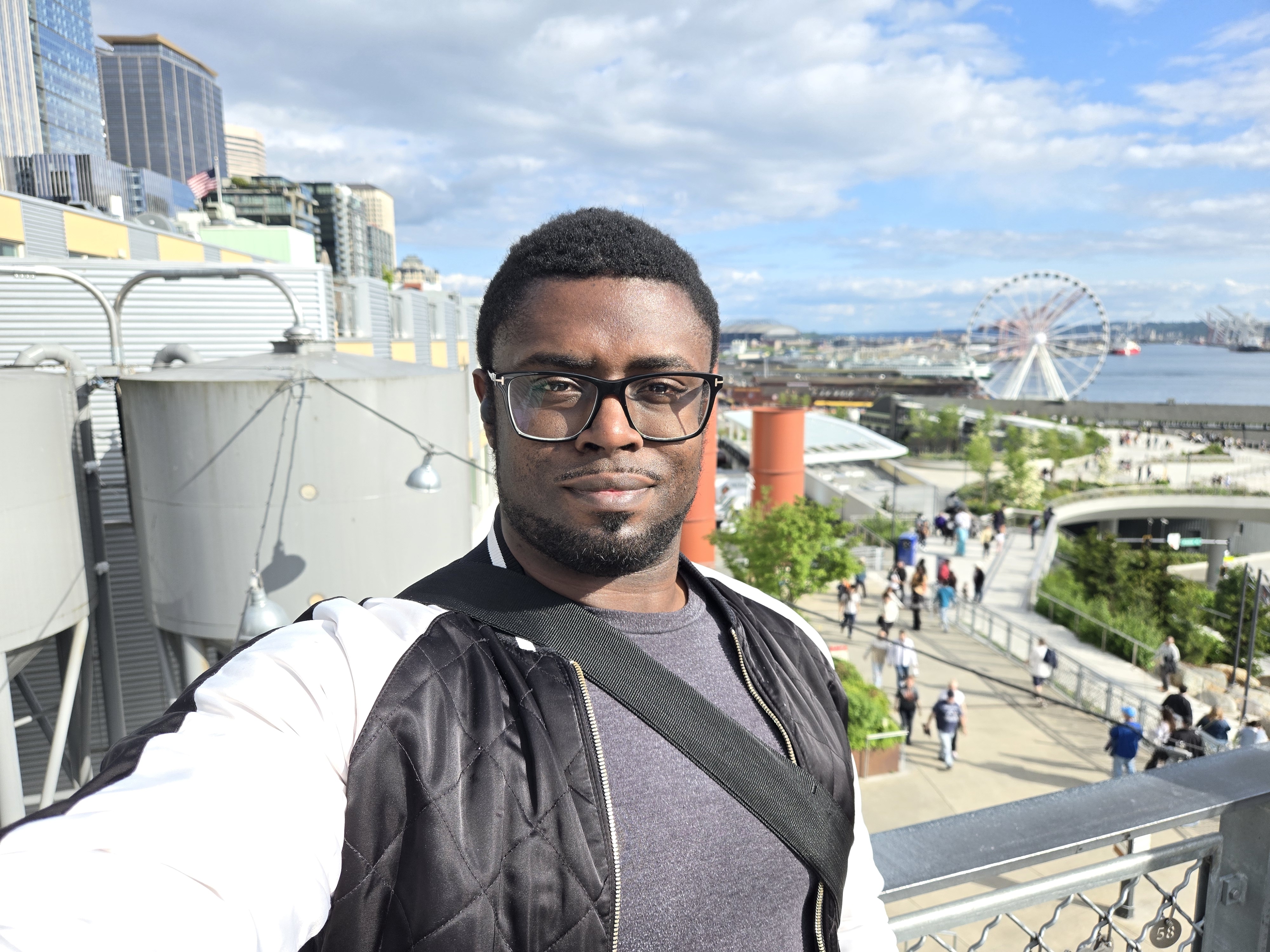 A selfie with a Ferris wheel in the distance