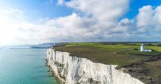 Aerial shot of the White Cliffs of Dover and the South Foreland lighthouse in Dover, Kent, UK