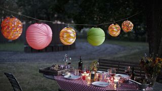 Lighting, Lantern, Table, Tablecloth, Furniture, Outdoor table, Tints and shades, Linens, Outdoor furniture, Chair,