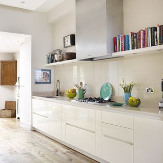kitchen with white wall and books
