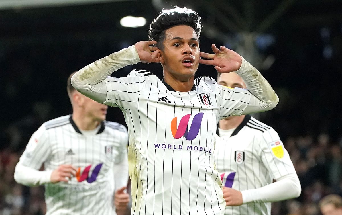 Fulham winger Fabio Carvalho celebrates with his fingers to his ears after scoring a goal