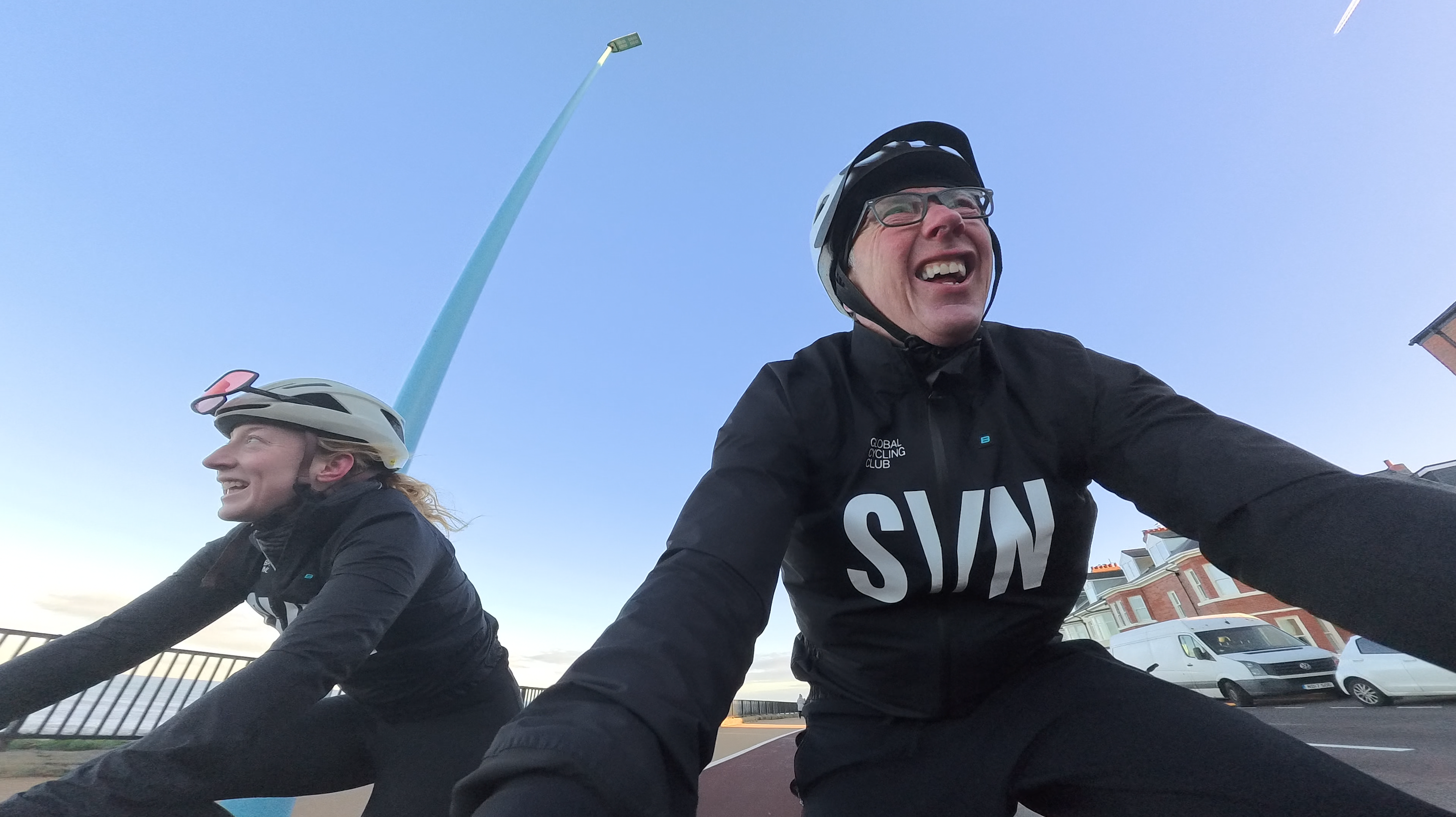 A man and woman cycling 