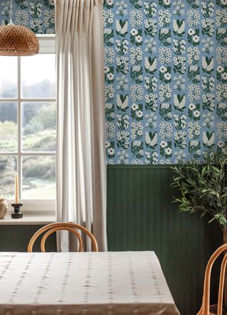 A two-tone effect is created with a half-wallpapered wall