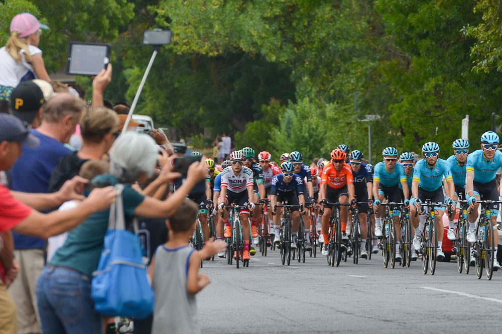 Crowds watch the Tour Down Under peloton pass by