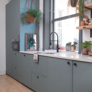 Scandi-inspired grey kitchen with slab doors and minimal handles.