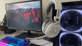 Corsair HS65 Wireless headset hooked on a gaming PC with a gaming monitor in the background