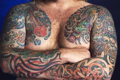 A man with many tattoos