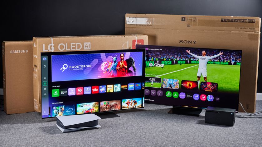 TVs showing smart interface screenshots with game consoles in foreground and shipping boxes in background
