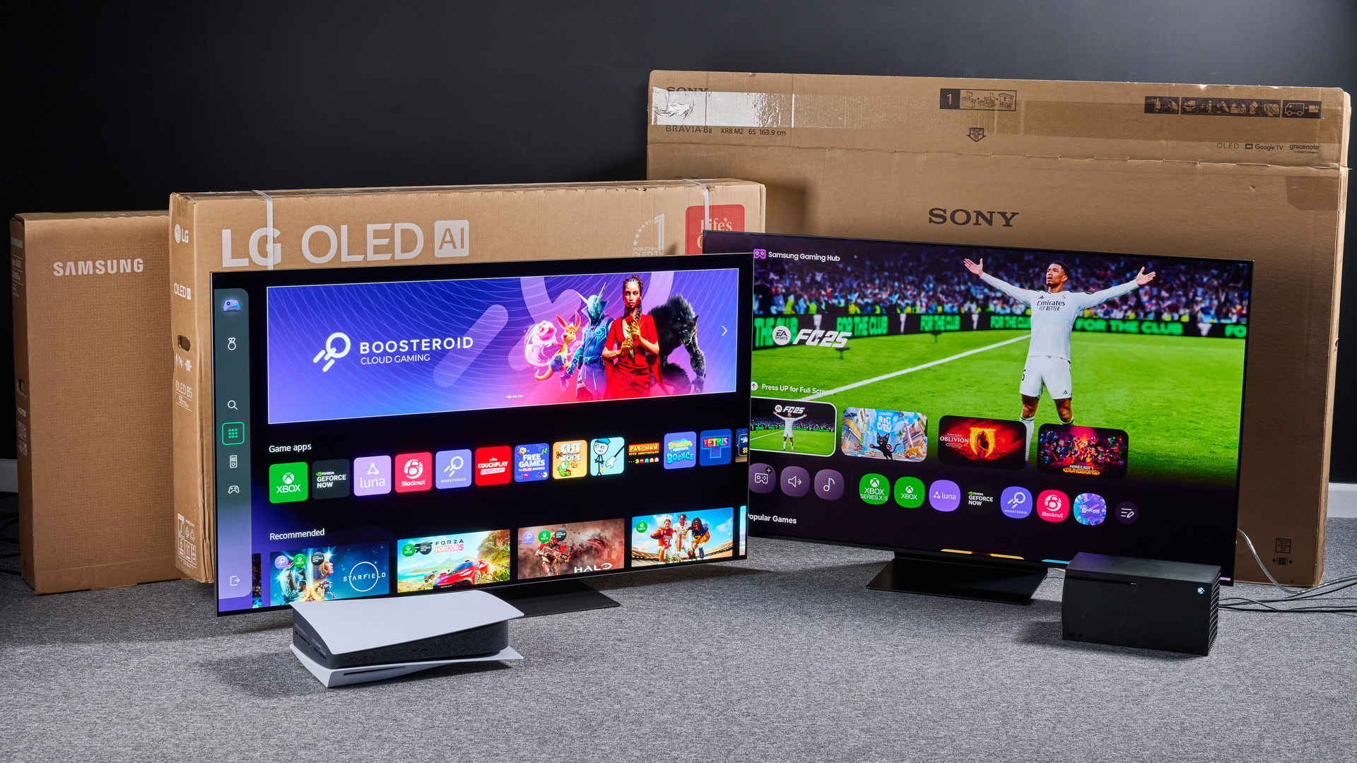 TVs showing smart interface screenshots with game consoles in foreground and shipping boxes in background