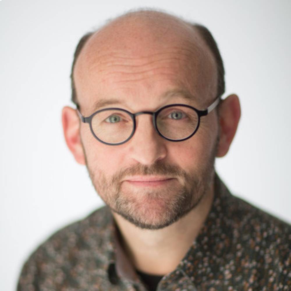 headshot of adrian james