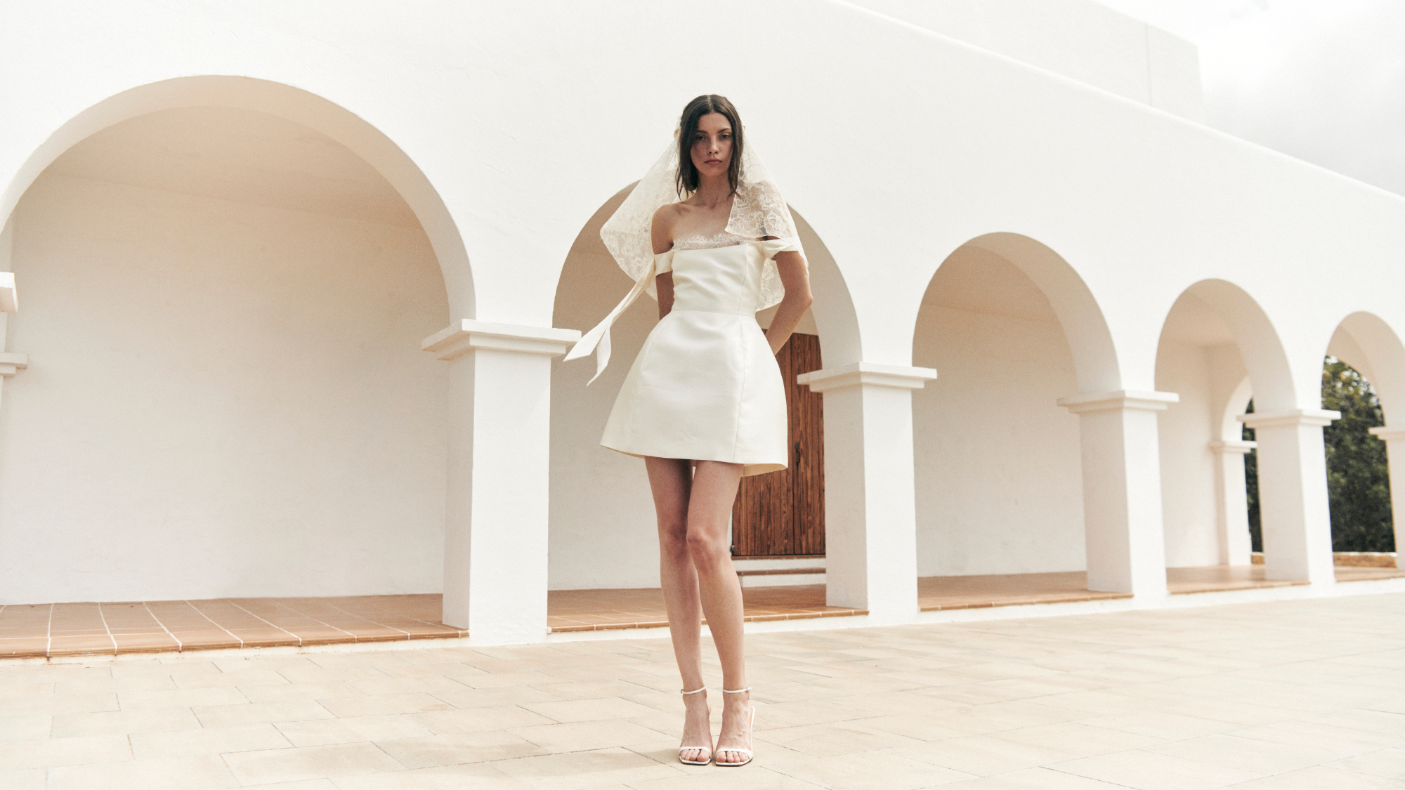 Model wears a mini wedding dress