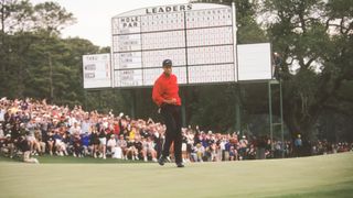 Tiger Woods celebrating on the final green of the 1997 Masters