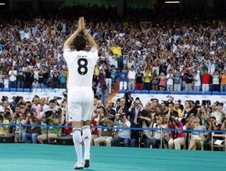 Kaka salutes the Real Madrid fans during his official presentation at the Santiago Bernabeu in June 2009.