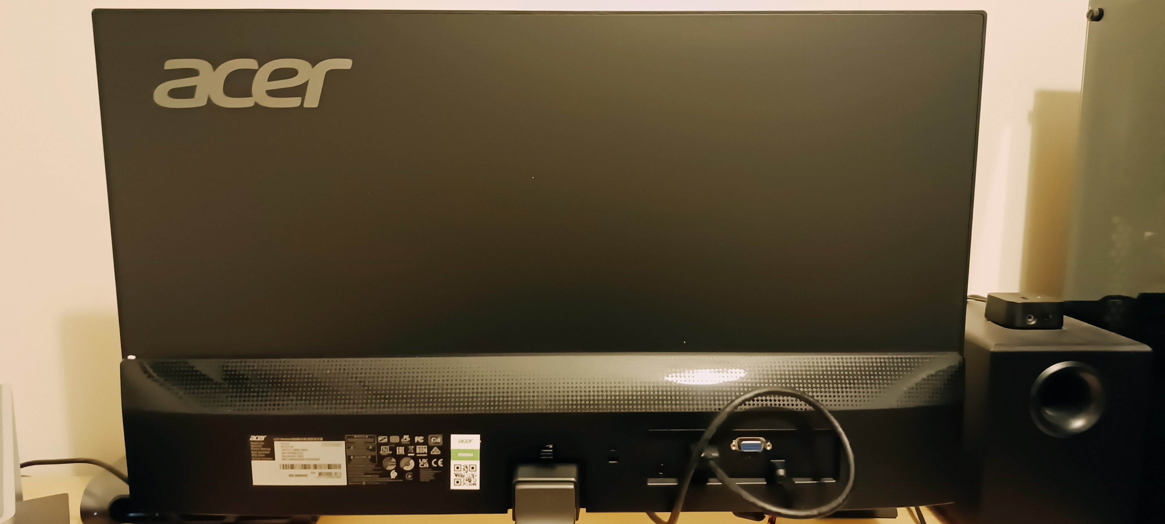 A black 27-inch Acer Vero RL272 monitor sitting on a wooden desk