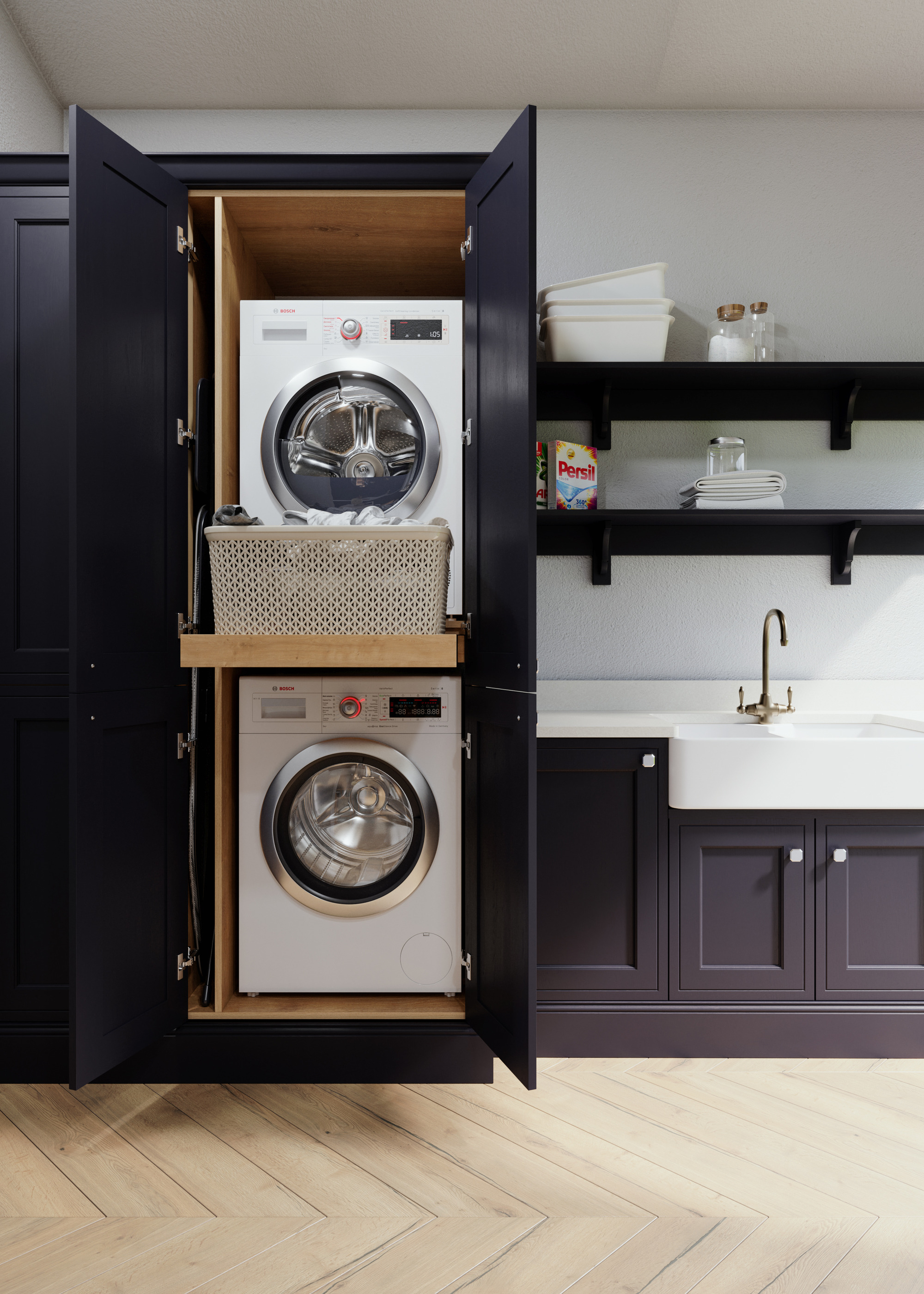 charcoal painted kitchen with integrated washer and dryer in a tall cabinet with doors open