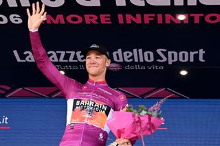 NAPLES ITALY MAY 11 Jonathan Milan of Italy and Team Bahrain Victorious Purple Points Jersey celebrates at podium during the 106th Giro dItalia 2023 Stage 6 a 162km stage from Naples to Naples UCIWT on May 11 2023 in Naples Italy Photo by Stuart FranklinGetty Images