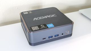 An overhead view of the Acemagic F2A mini PC on a desk