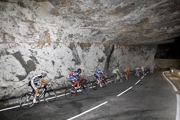 Racers pass through a tunnel