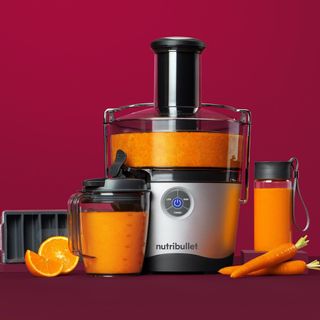 Nutribullet Pro Juicer on deep red background