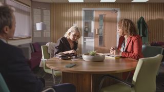 Andrew Treneman (Jamie Campbell), Serena Michelle Davies (Kerry Howard) and Kim Campbell (Angela Griffin) mid-meeting in Waterloo Road series 13 episode 8