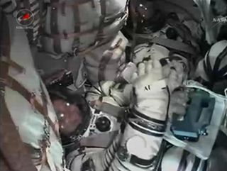 Expedition 40/41 Crew Inside Soyuz Capsule