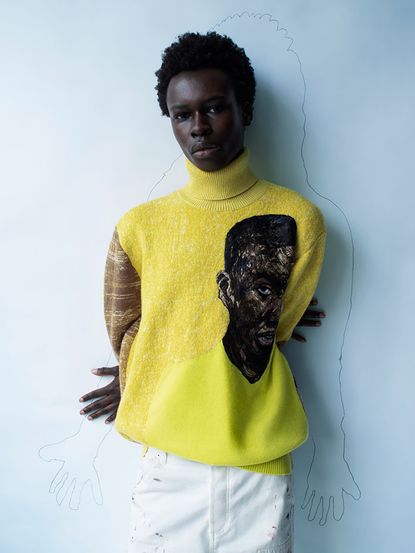 Yellow roll neck jumper with black face on by Dior