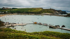 People swimming at the Bude Sea Pool in Cornwall