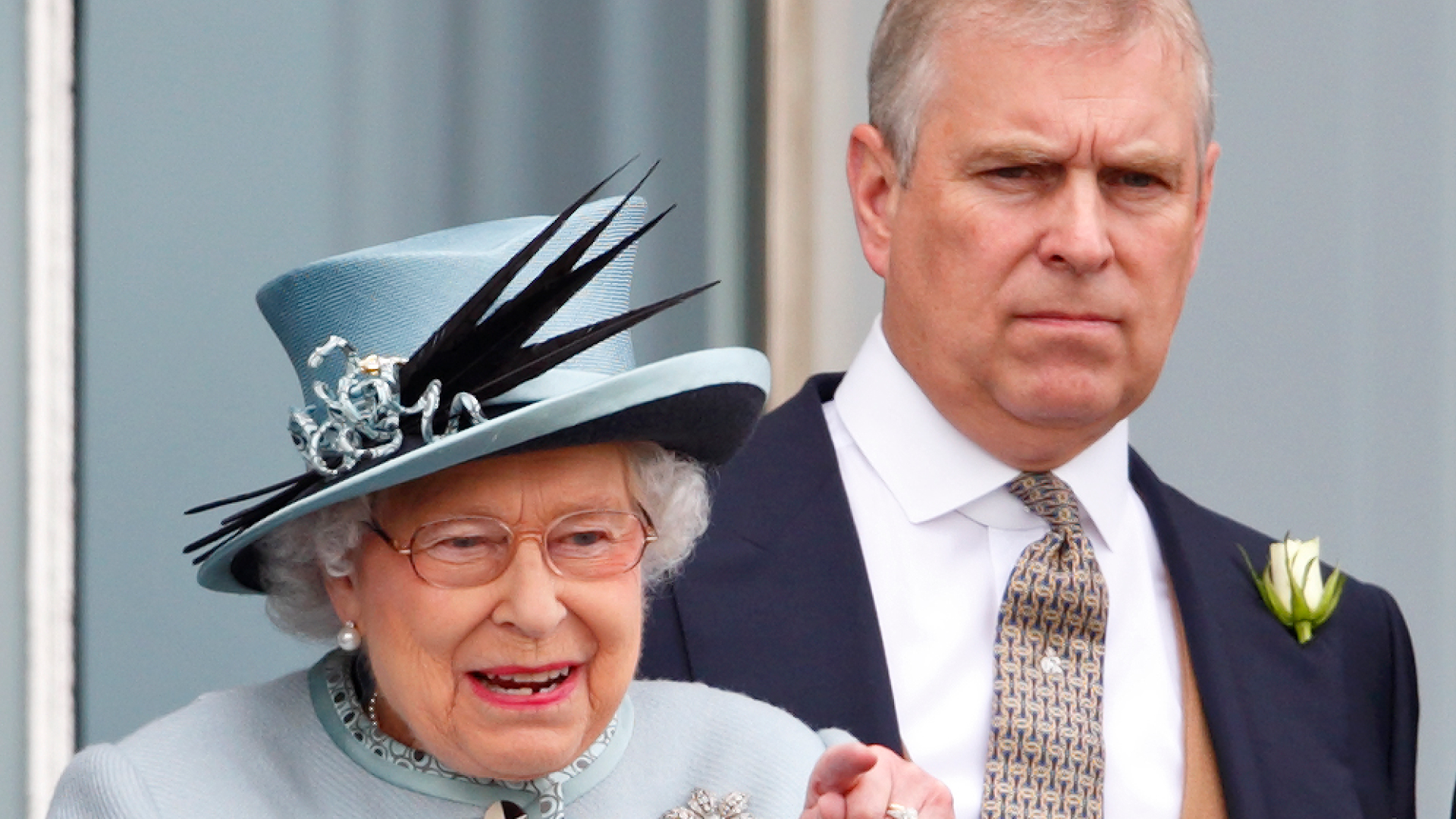 Queen Elizabeth wears a pale blue coat and matching hat as she watches horse races at Epsom with son ex-Prince Andrew