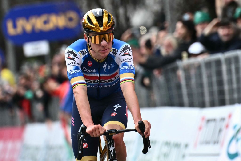 Soudal Quick-Step team's Belgian rider Remco Evenepoel cycles to the finish line to take second place in the 118th edition of the Giro di Lombardia (Tour of Lombardy), a 252km cycling race from Bergamo to Como on October 12, 2024. (Photo by Marco BERTORELLO / AFP)