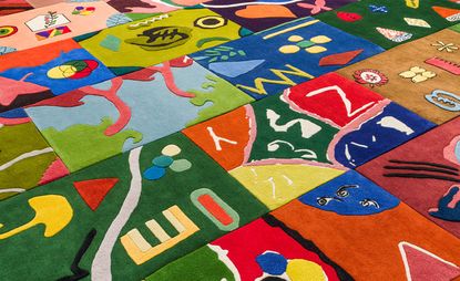 A grid of colourful rugs, from an initiative by Alex Proba, Little Proba and the Toni Garrn Foundation