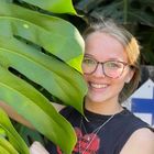 smiling headshot of Kiersten Rankel from Greg with a leaf