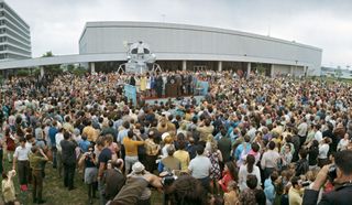 A large crowd of onlookers watches President Richard M. Nixon bestow the Presidential Medal of Freedom upon the Apollo 13 Mission Operations Team — the highest civilian award.