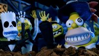 A claymation scene featuring Simpsons characters reimagined in the dark, whimsical aesthetic of The Nightmare Before Christmas