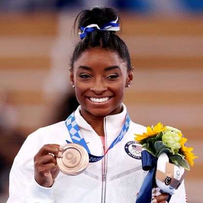 tokyo, japan august 03 simone biles of team united states poses with the bronze medal during the womens balance beam final medal ceremony on day eleven of the tokyo 2020 olympic games at ariake gymnastics centre on august 03, 2021 in tokyo, japan photo by jamie squiregetty images