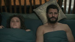 Jamie Dornan (R) in bed with Danielle Macdonald (L) when you watch The Tourist season 2