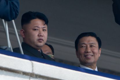 Kim Jong-Un sits with China's Vice President Li Yuanchao.