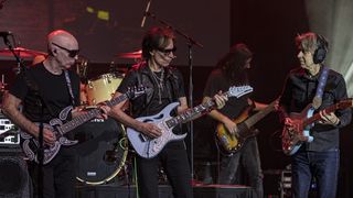 Eric Johnson, Joe Satriani and Steve Vai performing at a 2024 G3 concert