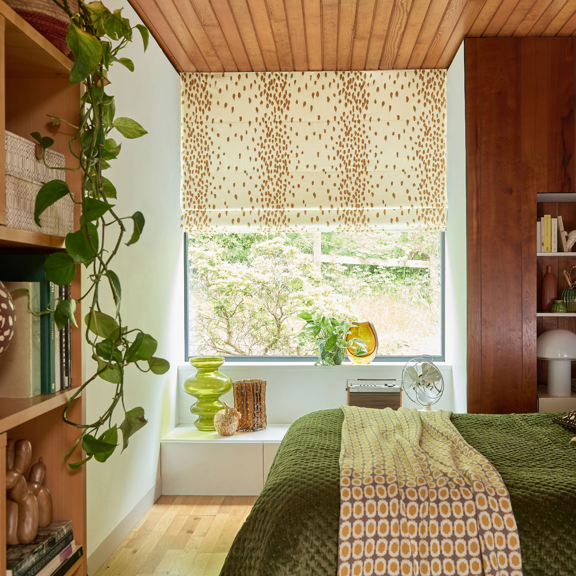 bedroom with timber wall and ceiling panelling
