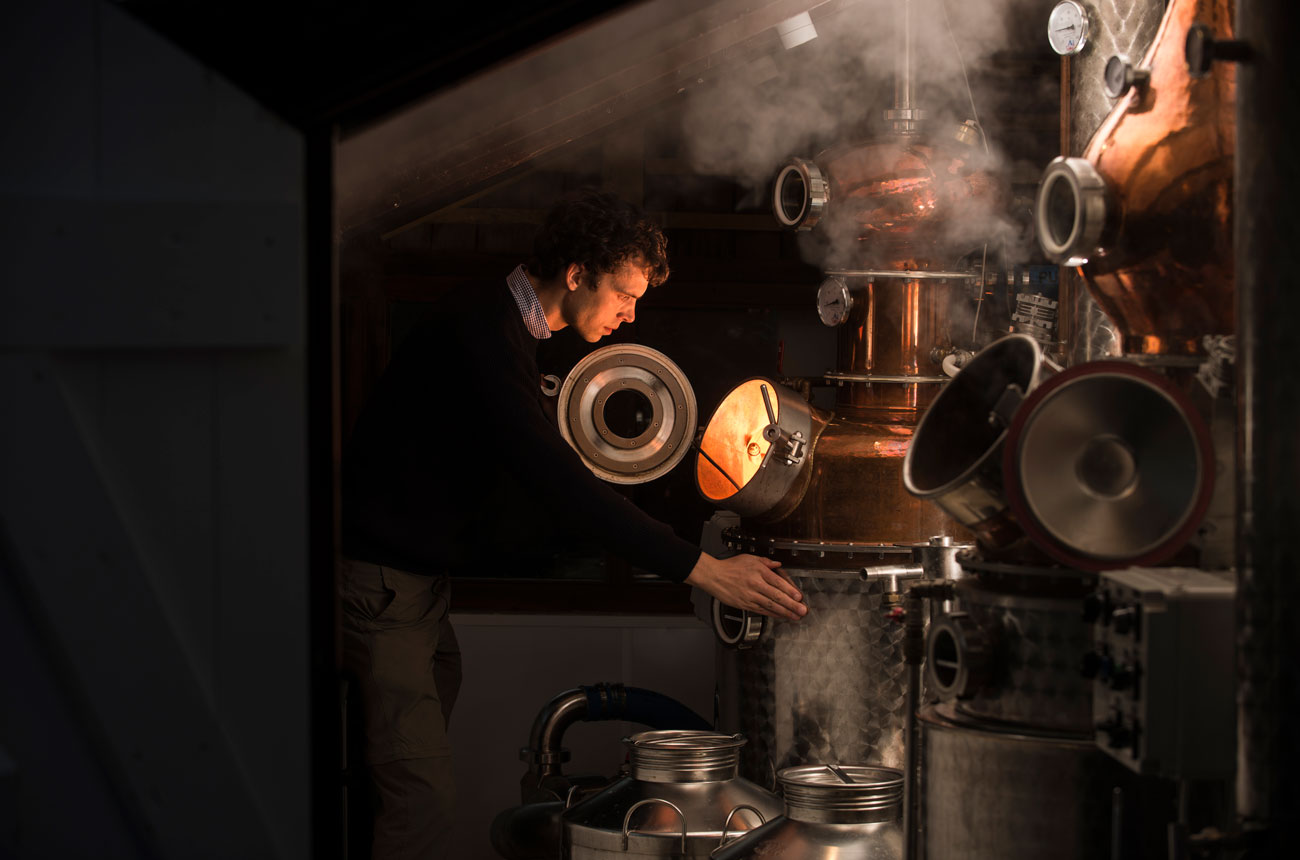 Barney Wilczak checks the still at Capreolus Distillery