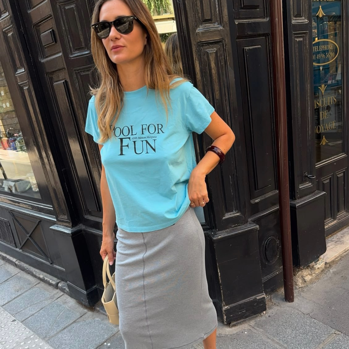 An image of a woman wearing skinny wedge sandals