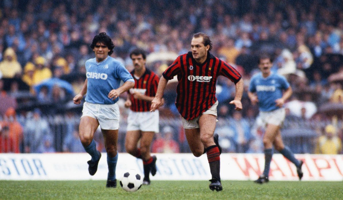 Ray Wilkins of Milan pulls away from Diego Maradona of Napoli during a Serie A match, 1984
