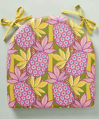 Pink and yellow pineapple motif indoor and outdoor cushion