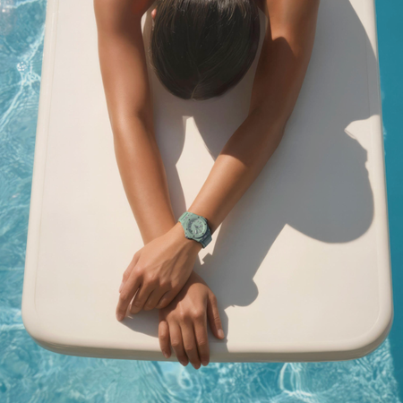 woman wearing green Hublot sports watch