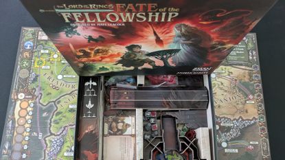 Fate of the Fellowship box seen from above, with a board and box of components below