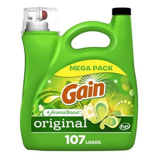 A green bottle Gain Liquid Laundry Detergent with green and yellow label and red logo