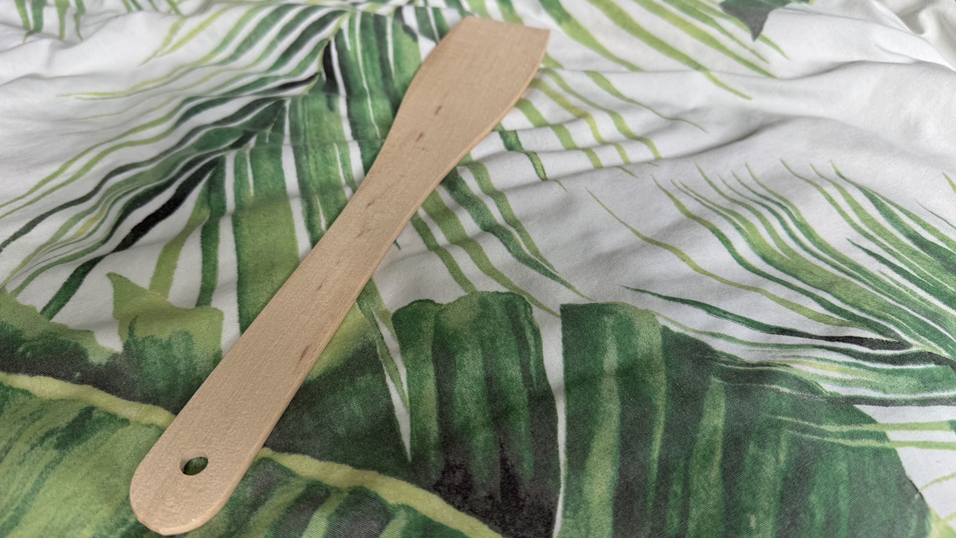 A spatula on a bed