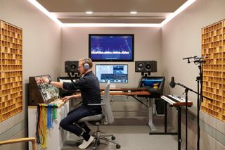 View of an audio designer creating custom sounds in the Apple Design Studio sound lab at Apple Park