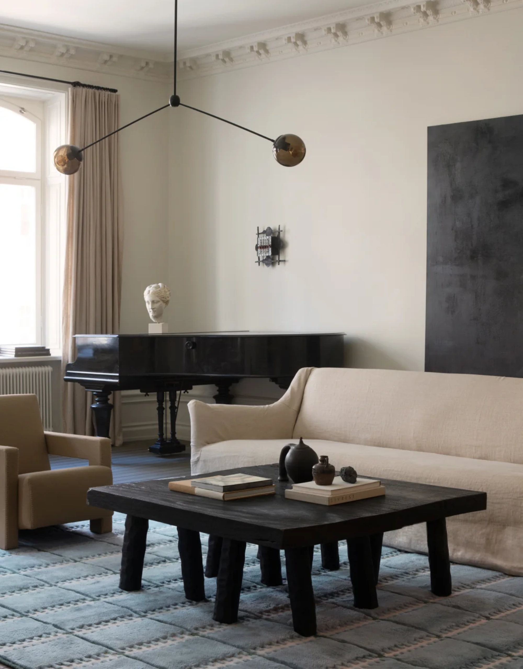 A blue square tufted rug from LAYERED